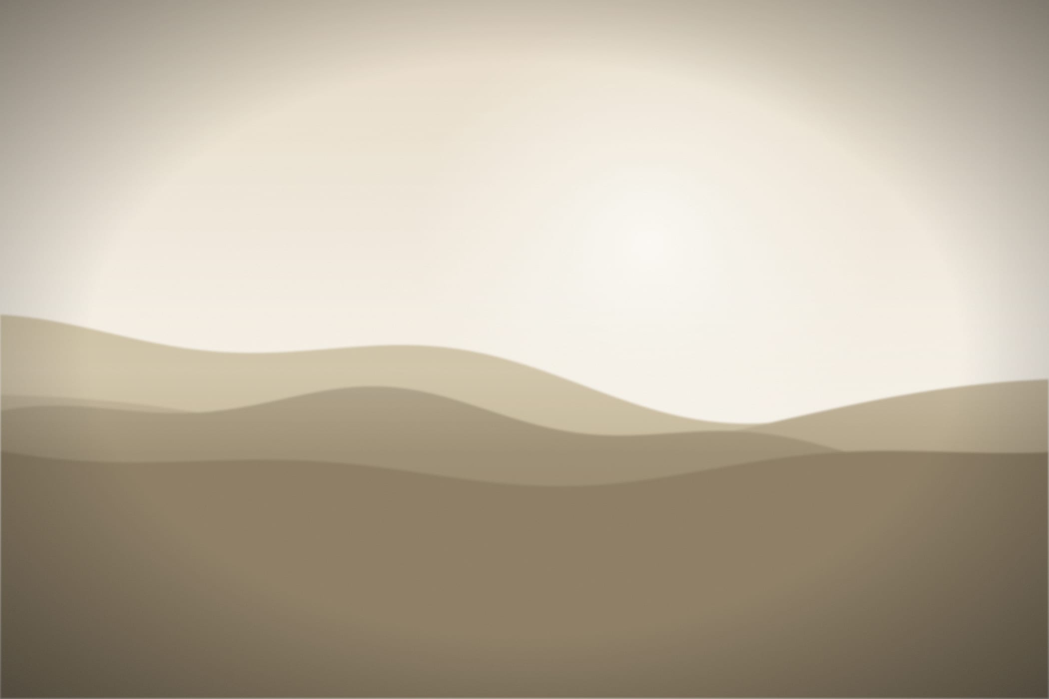 Soft sand-coloured hills under a pale sky