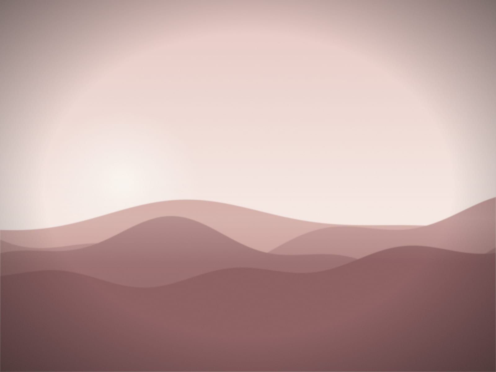 Soft pink light over low hills